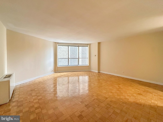 empty room featuring baseboards