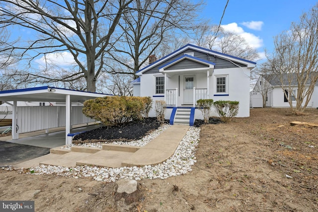 view of front of property with a carport