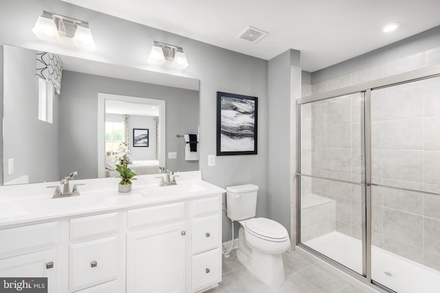 full bath featuring double vanity, a sink, visible vents, and a shower stall