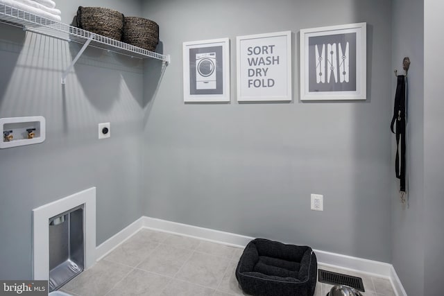 laundry room with washer hookup, visible vents, electric dryer hookup, laundry area, and baseboards