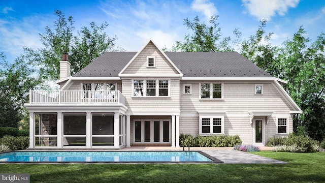 back of house featuring a balcony, a yard, an outdoor pool, a chimney, and a patio area