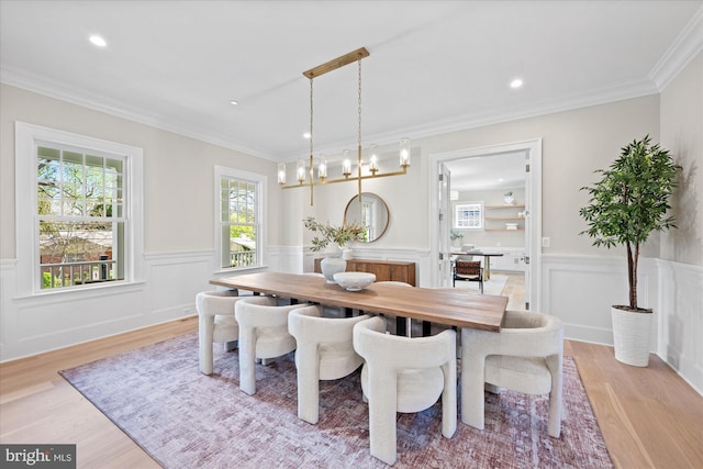 5408 Moorland Ln, Bethesda, MD 20814 - dining area featuring light wood finished floors, a wainscoted wall, a chandelier, ornamental molding, and recessed lighting