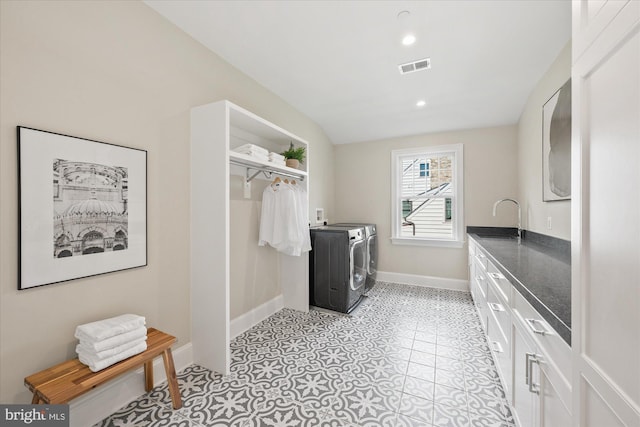 5408 Moorland Ln, Bethesda, MD 20814 - laundry room with washer and clothes dryer, a sink, baseboards, recessed lighting, and light tile patterned floors