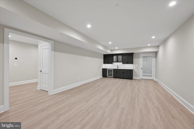 5408 Moorland Ln, Bethesda, MD 20814 - unfurnished living room with light wood-style floors, baseboards, recessed lighting, and beverage cooler