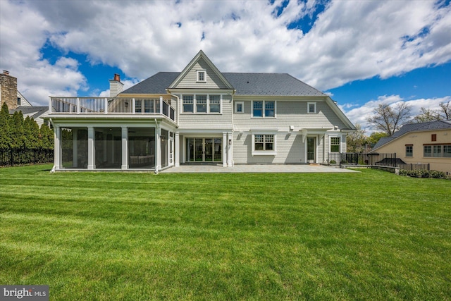 5408 Moorland Ln, Bethesda, MD 20814 - rear view of house featuring a chimney, a sunroom, and a patio