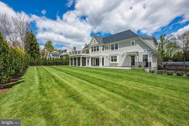 5408 Moorland Ln, Bethesda, MD 20814 - back of house with a patio area and a lawn