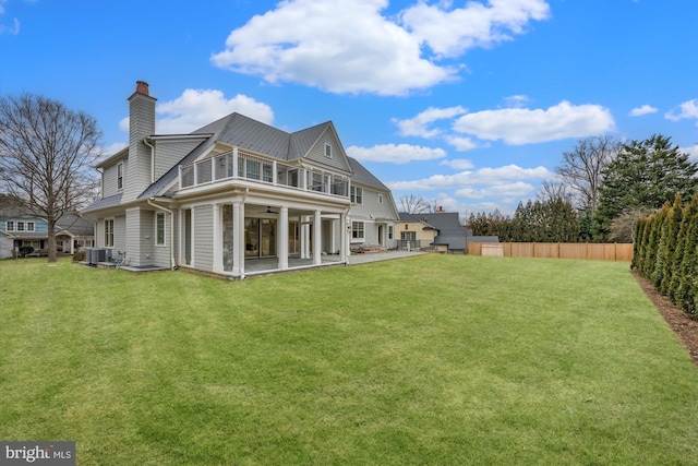 back of property with a patio area, a lawn, a fenced backyard, and central AC unit