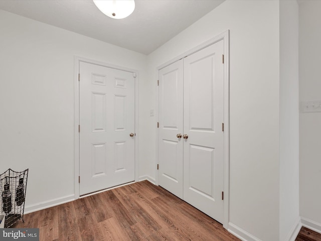 foyer entrance with hardwood / wood-style flooring