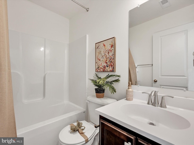 full bathroom with vanity, shower / tub combination, and toilet