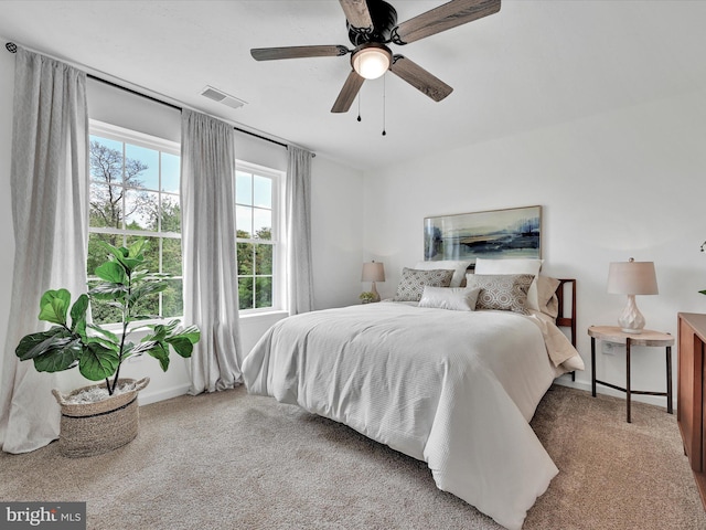 carpeted bedroom with ceiling fan