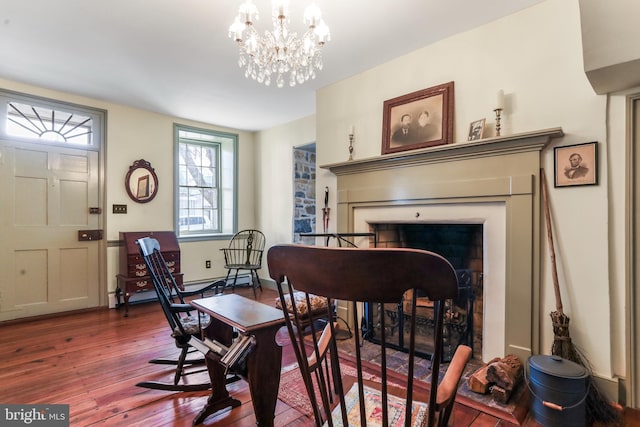 interior space featuring an inviting chandelier and hardwood / wood-style floors