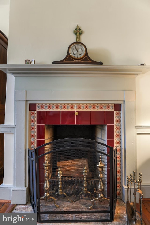 interior details with a tiled fireplace