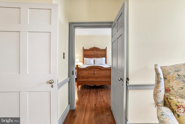 hall featuring dark wood-type flooring