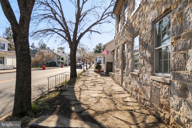 view of street featuring a residential view and sidewalks