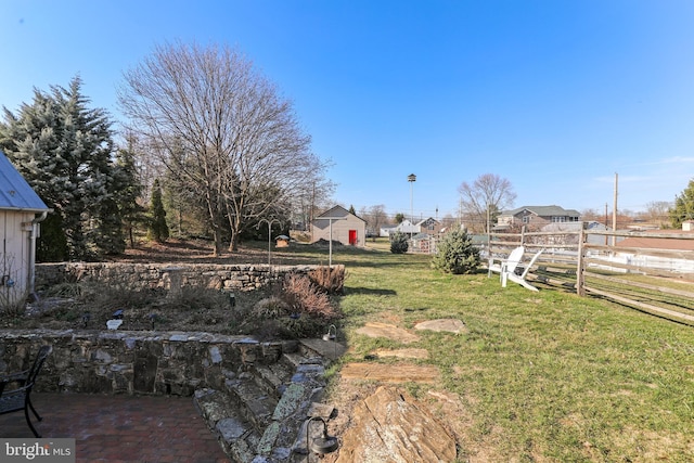 view of yard featuring a patio area and fence