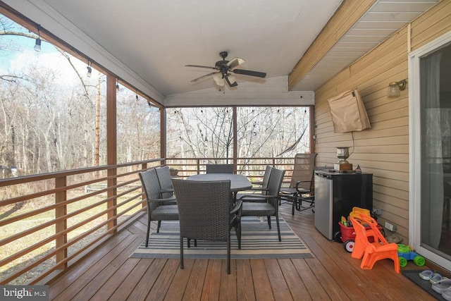 wooden deck featuring ceiling fan