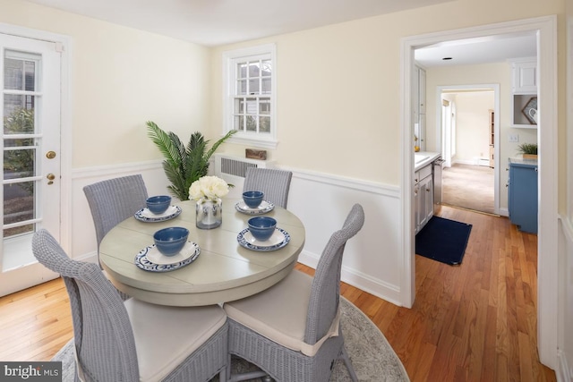 dining area with light wood-style flooring