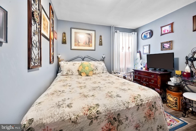 bedroom featuring hardwood / wood-style floors