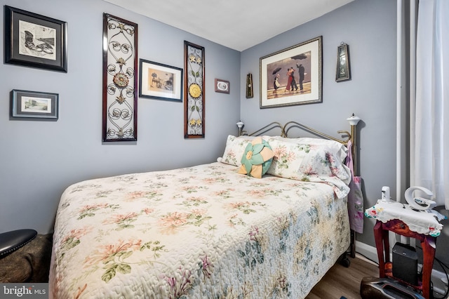 bedroom featuring dark hardwood / wood-style floors