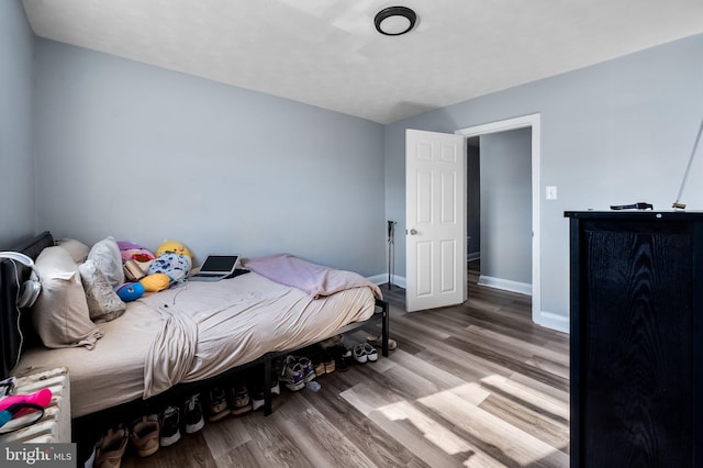 bedroom featuring hardwood / wood-style floors