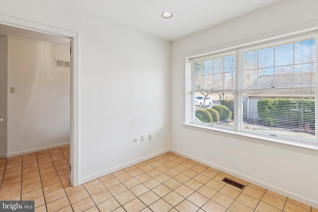 spare room with light tile patterned floors, recessed lighting, visible vents, and baseboards