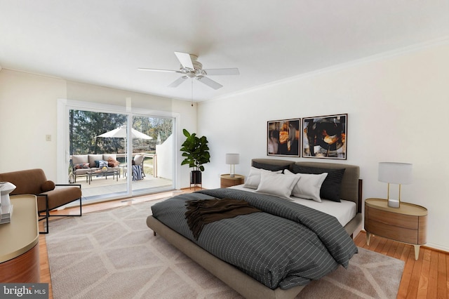 bedroom with access to outside, crown molding, ceiling fan, and wood finished floors