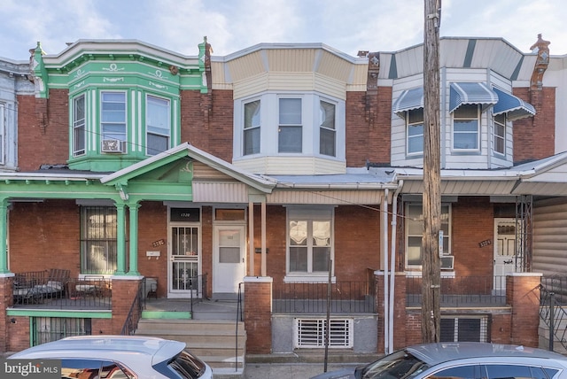 townhome / multi-family property featuring brick siding