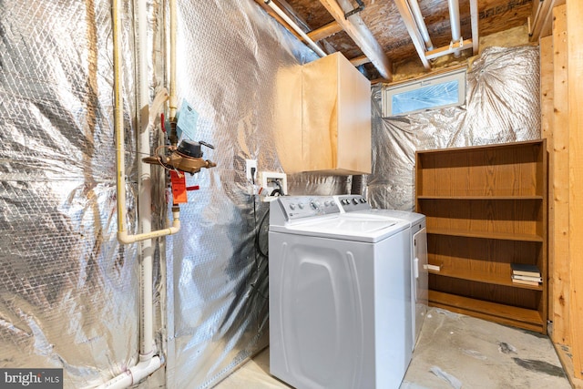 clothes washing area featuring washing machine and clothes dryer