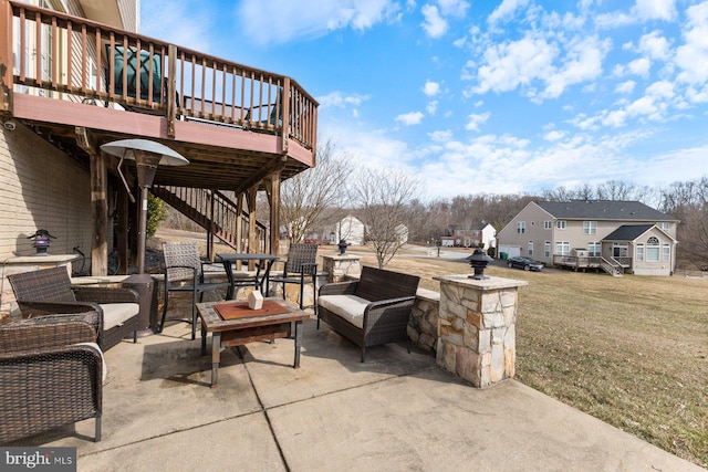 view of patio / terrace featuring a residential view, an outdoor hangout area, a wooden deck, and stairs