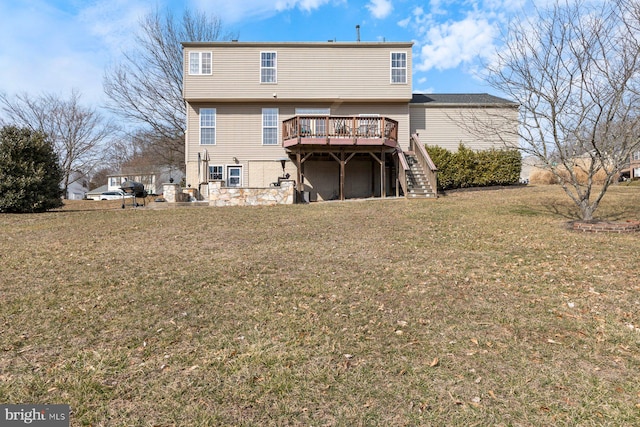 rear view of property featuring stairs, a lawn, and a wooden deck