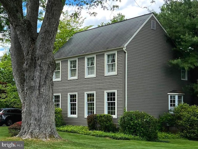 view of home's exterior featuring a yard