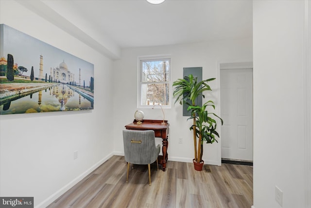 home office with light hardwood / wood-style floors