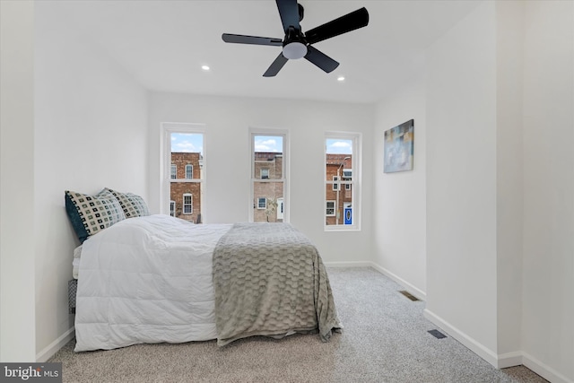 bedroom with ceiling fan and carpet flooring