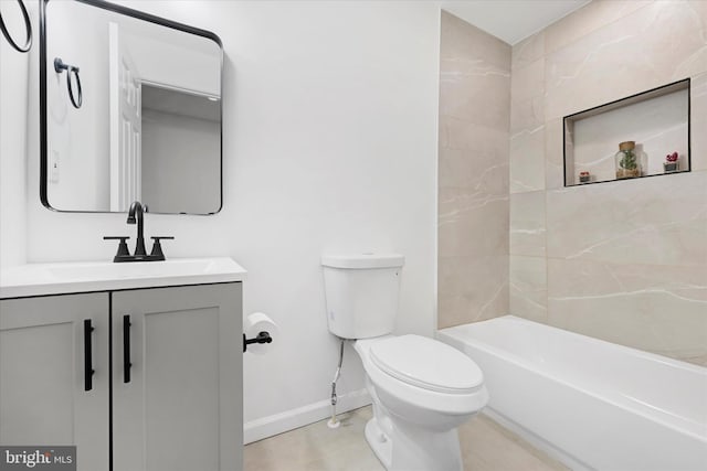 full bathroom with tiled shower / bath combo, vanity, and toilet