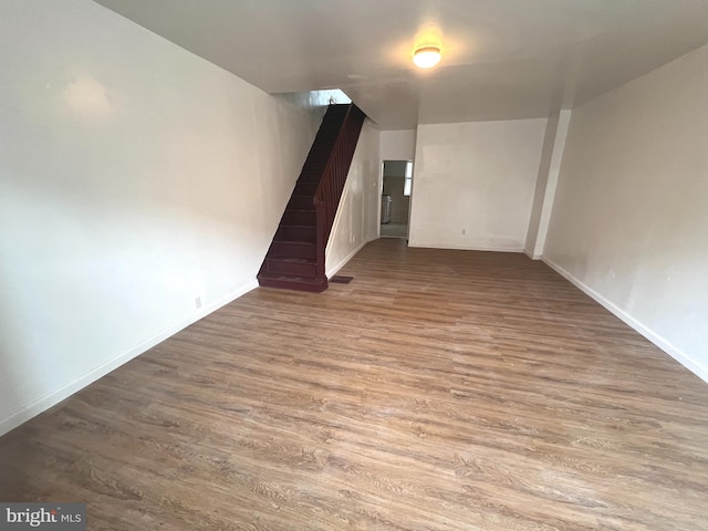 unfurnished room with hardwood / wood-style flooring