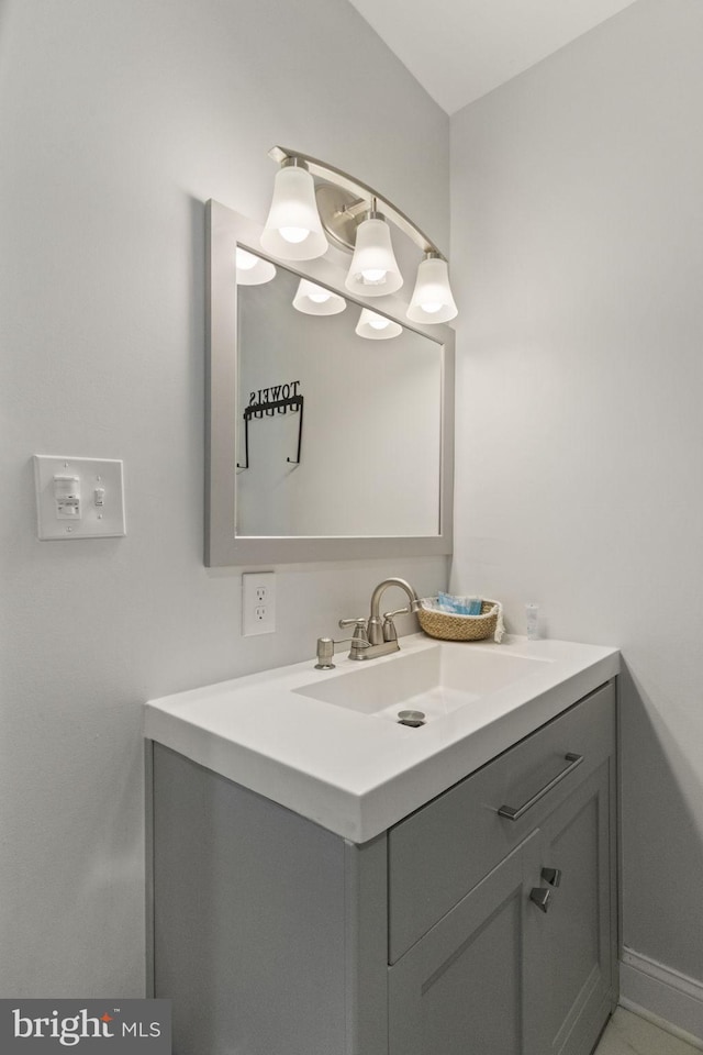 bathroom with baseboards and vanity