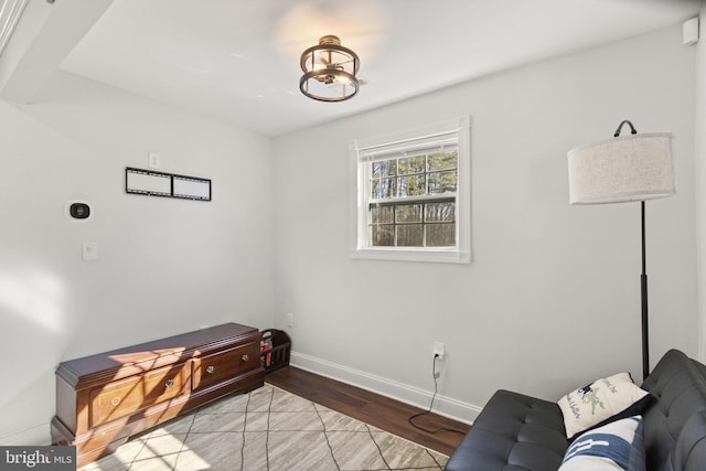 living area with light wood finished floors and baseboards