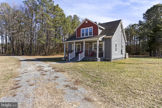 view of front of home featuring a porch, crawl space, roof with shingles, and a front lawn