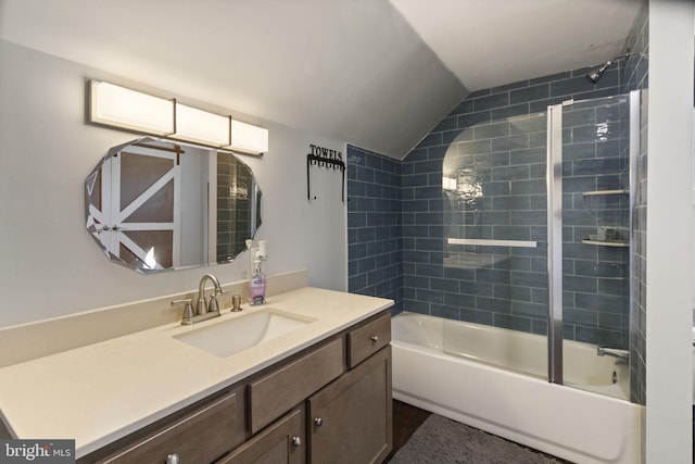 full bath featuring lofted ceiling, tub / shower combination, and vanity