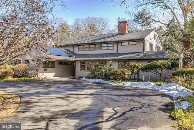 view of front of home featuring solar panels