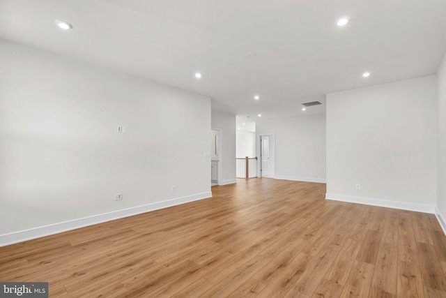 unfurnished room with light wood-type flooring