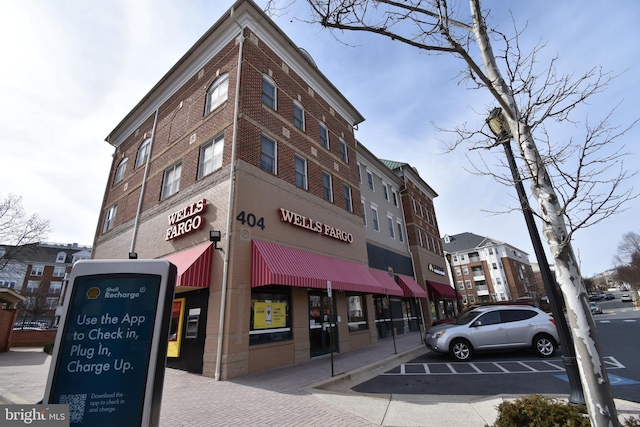 view of property featuring uncovered parking