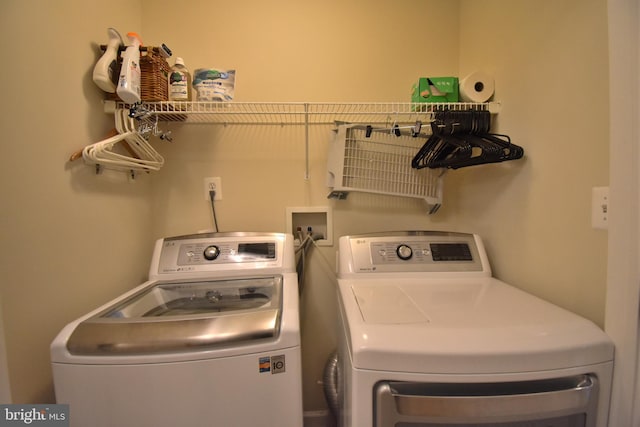 washroom with laundry area and washer and clothes dryer