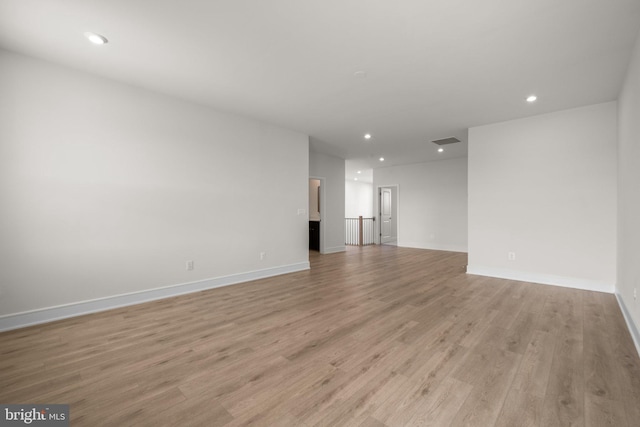 unfurnished living room featuring light hardwood / wood-style floors