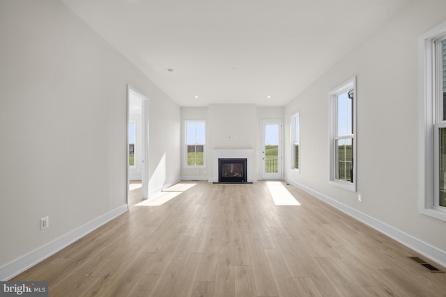 unfurnished living room with light hardwood / wood-style floors