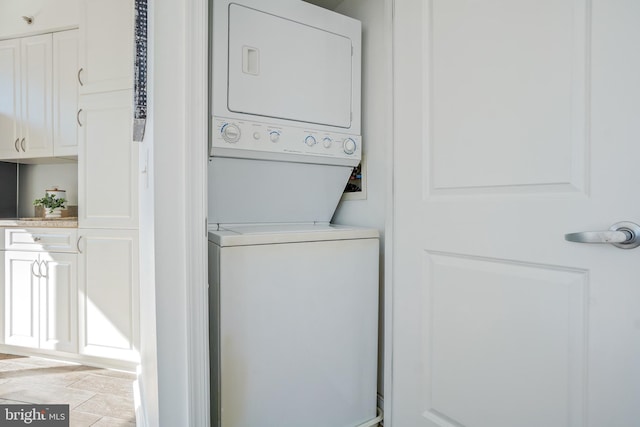 laundry room with laundry area and stacked washing maching and dryer