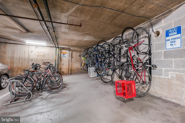 garage with concrete block wall and bike storage