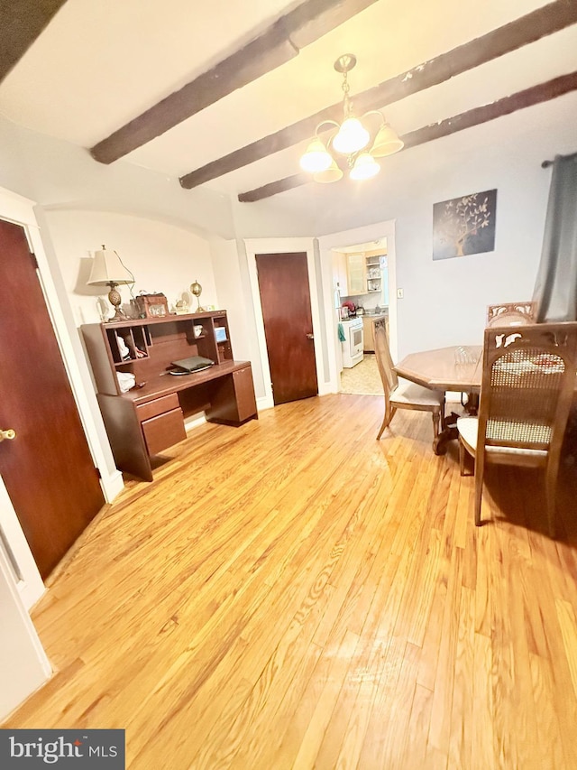 living area featuring wood-type flooring, beamed ceiling, and a notable chandelier