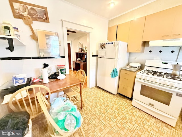 kitchen featuring white appliances, cream cabinets, ornamental molding, and decorative backsplash