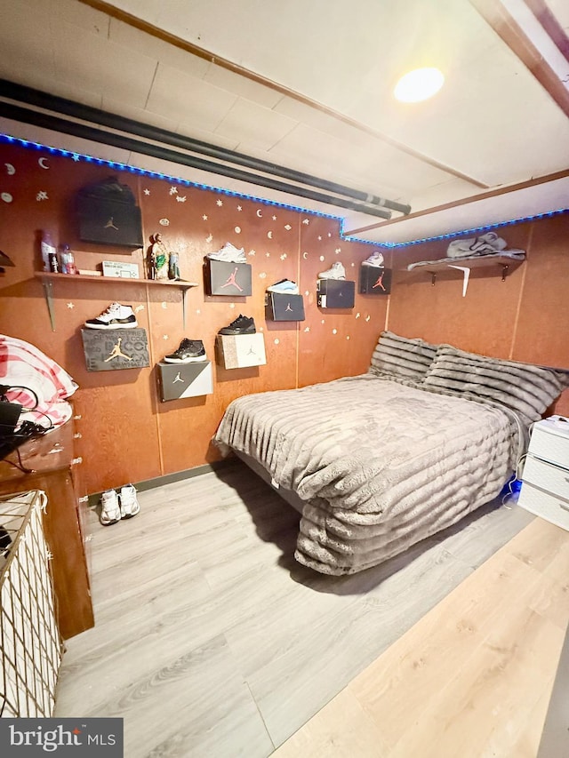 bedroom with wood-type flooring